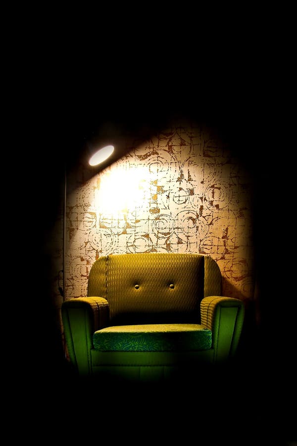 Alone chair in dark room royalty free stock photo