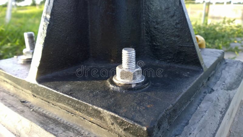 Anchor bolt and jacking bolt used to fix the machine in place of machine installation. In thailand royalty free stock photo