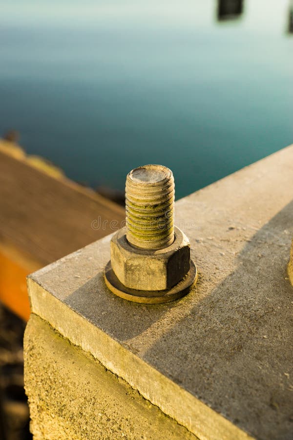 Anchor Bolt Up Close. Anchor Bolt at The Pier During Sunset/Sunrise stock photos