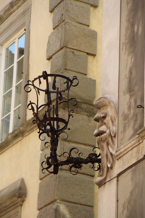 Architectural decoration with imitation of a lantern in the city of Lucca, Italy. The picture was taken on August 6, 2015 royalty free stock photography