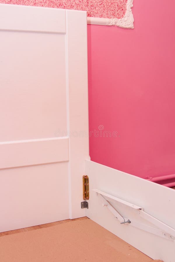 Lifting mechanism on the bed,assembling a bed in a pink room royalty free stock images