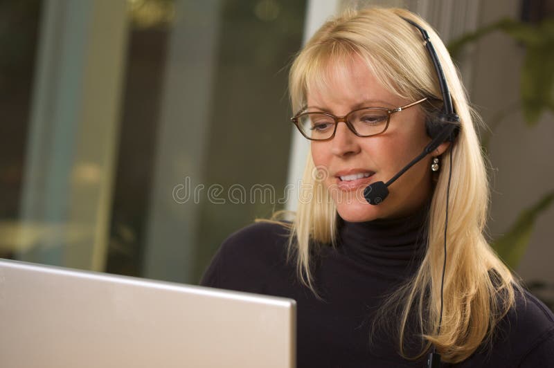 Attractive Businesswoman with Phone Headset royalty free stock photos