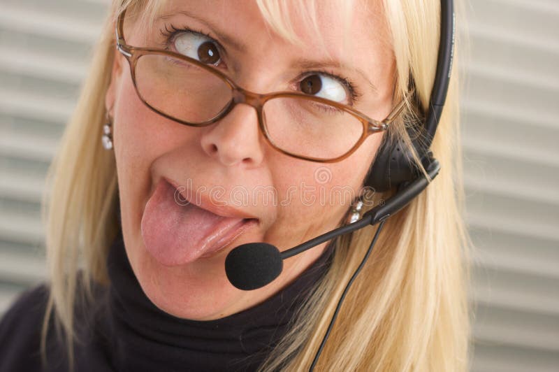 Attractive Businesswoman with Phone Headset royalty free stock photography