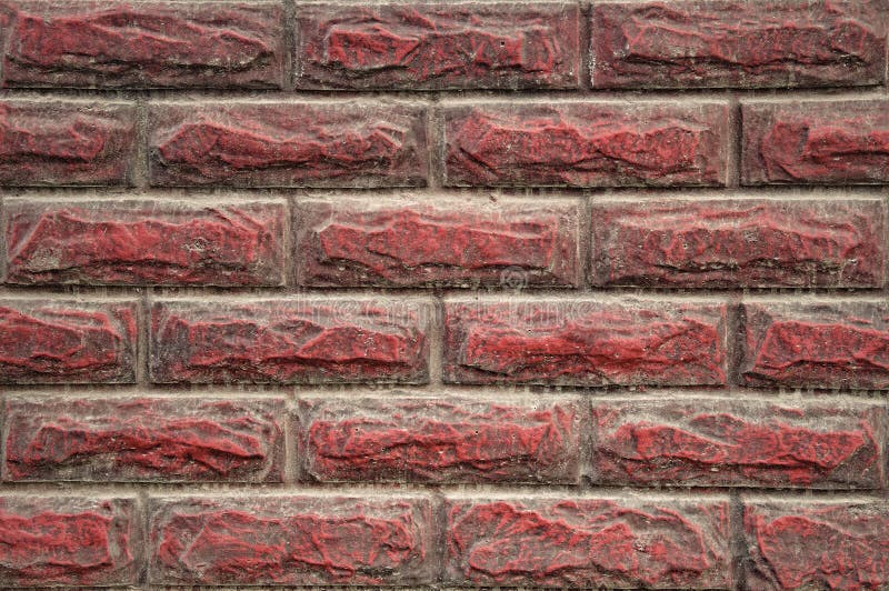 Background wall and stone texture, for exterior. Finishing stone, design. Red, dirty, with dust and drips from the rain. Background wall and stone textures, for stock photography