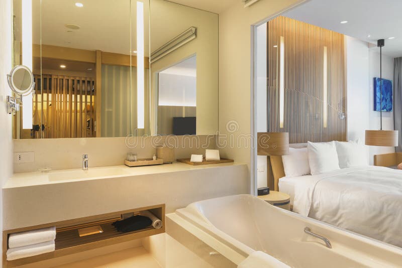 Bathroom interior of a hotel room with modern design. Interior of a bathroom of a hotel room with see through window stock photos