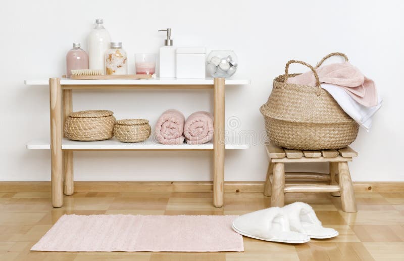 Bathroom partial interior with wooden shelf, stool and spa products royalty free stock image