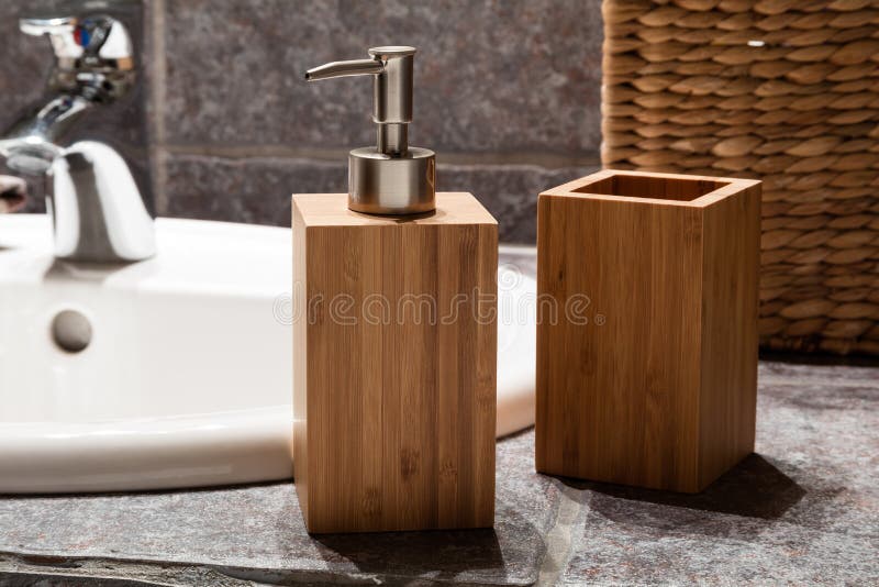 Bathroom sink area design, in bathroom with dark tiles. Mirror and decorations royalty free stock images