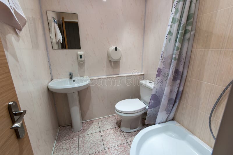 Bathroom with sink toilet and shower tray. Combined bathroom with sink toilet and shower tray stock images