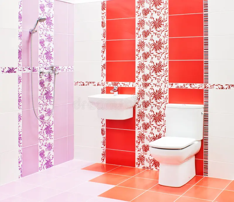 Bathroom with toilet and sink. Modern red and pink bathroom with toilet and sink royalty free stock photography