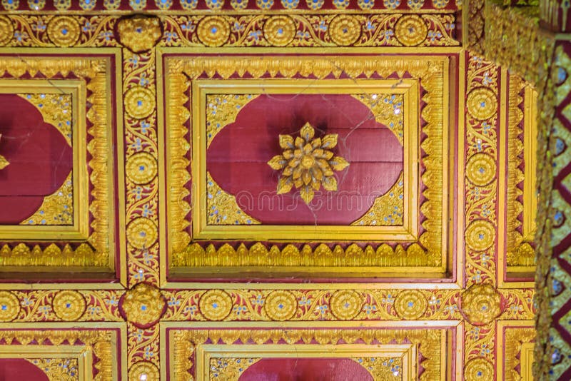 Beautiful golden decorated ceiling in lotus shape with lamp at t. He Buddhist church, Thailand stock photos