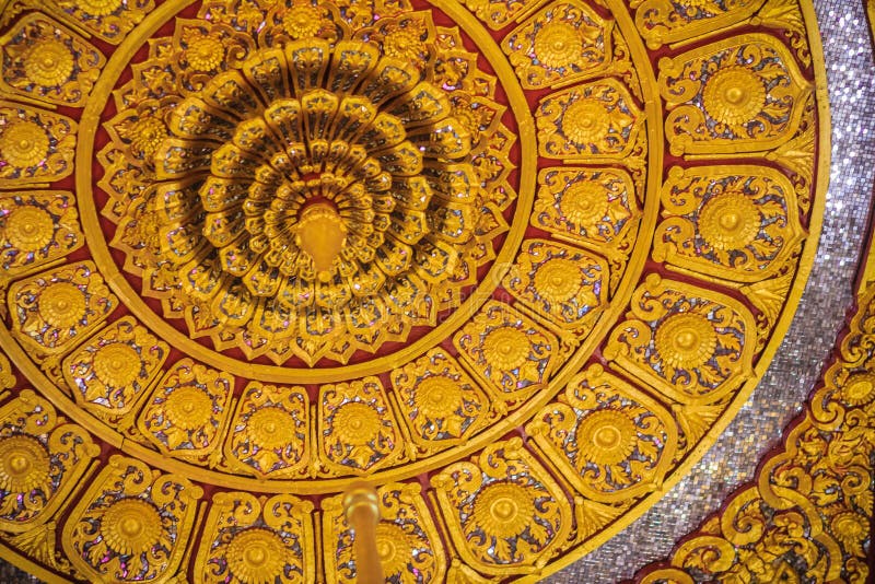 Beautiful golden decorated ceiling in lotus shape with lamp at t. He Buddhist church, Thailand royalty free stock photos
