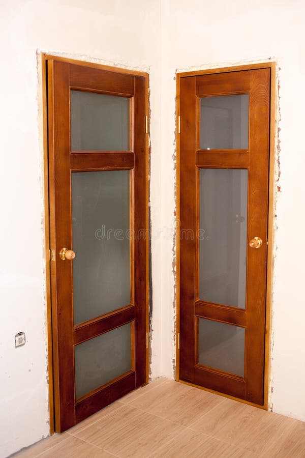 Beautiful installed wooden doors in the house. Door royalty free stock photo