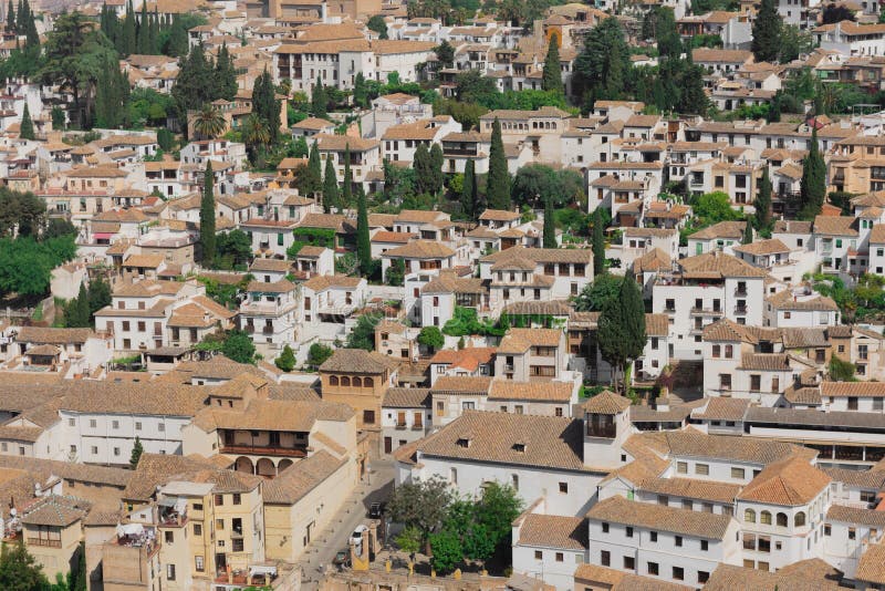 Beautiful white houses with brown ceilings, typical from Andalusia, Spain. The view is from the Alhambra stock photography