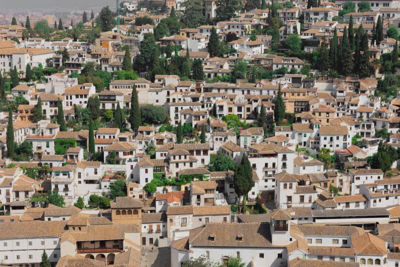 Beautiful white houses with brown ceilings, typical from Andalusia, Spain. The view is from the Alhambra stock photo