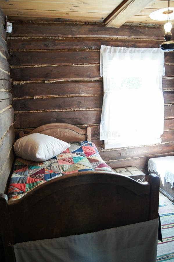 Bed in a Russian hut. Interior items with ancient utensils Old Russian life stock images