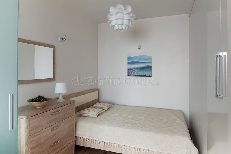Bedroom interior in small modern apartment in scandinavian style royalty free stock images