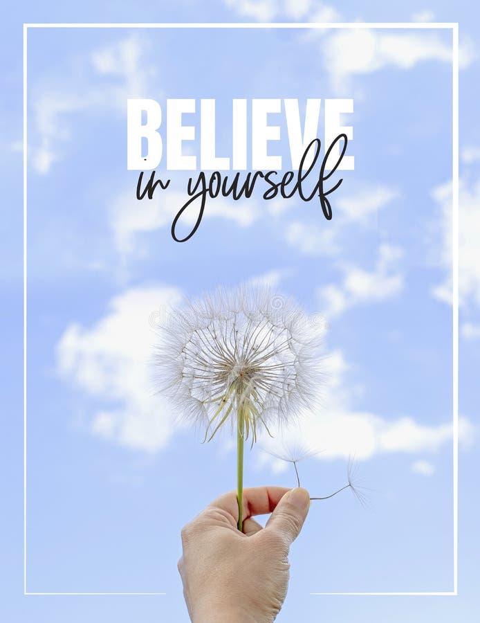 Believe in yourself, Hand holding Dandelion flower pointing to blue sky, close up photography, banner design royalty free stock image