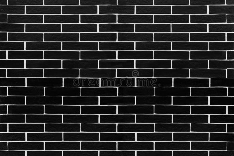 Black brick tiles with white contrasting grouting. Background stock photos