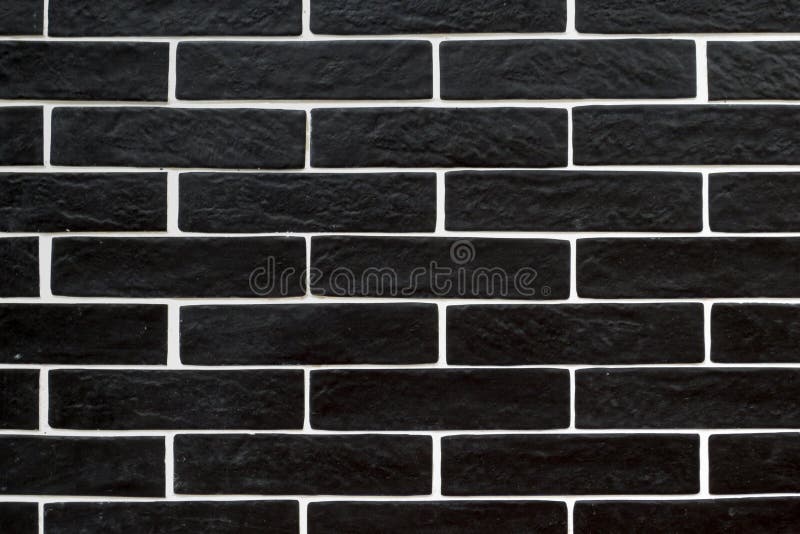 Black brick tiles with white grouting. Textures stock images