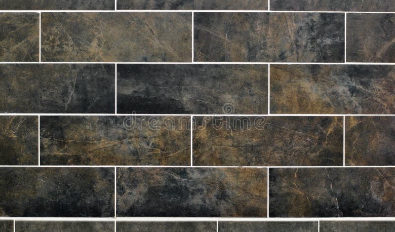 Wall tile background with dark colors. Black and brown horizontal wall tile pattern with a dark and marbled appearance stock image