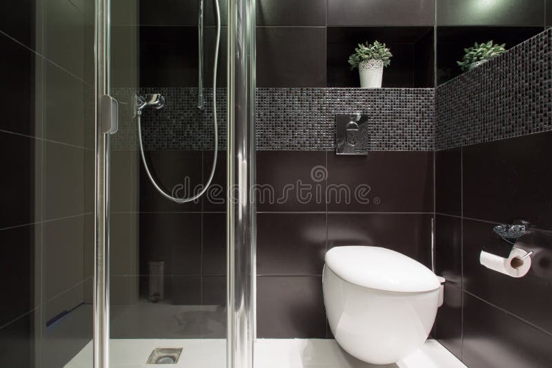 Black tiles at the bathroom. Horizontal view of black tiles at the bathroom stock images