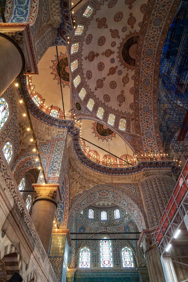 The blue mosque beautiful interior ornamental decoration of dome ceiling, arch windows and columns and lighting with historical. Restoration framework stock images