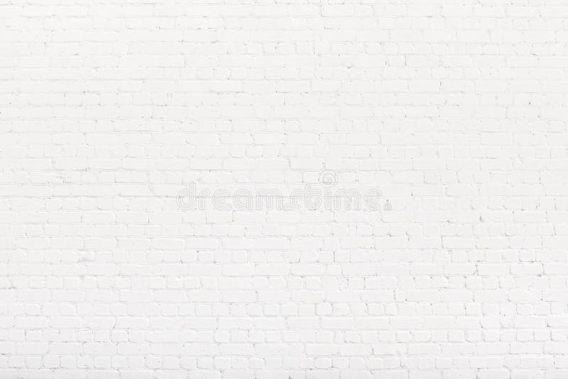 Brick wall painted with white paint. White Loft background, texture. Copy space stock image