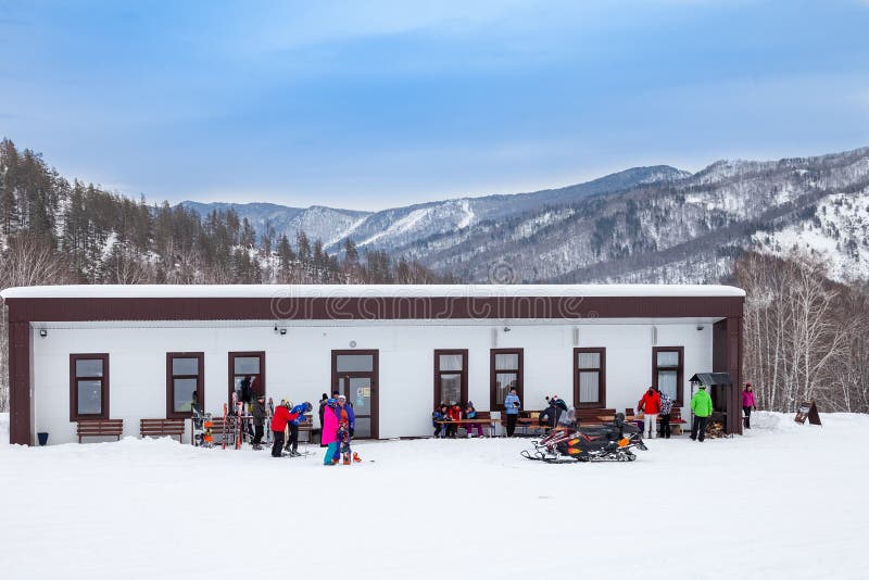 Building with rental of ski equipment and snowboards in the sports tourist base Turquoise Katun. Seasonal sports. Altai, Russia - 01.01.2020: Building with royalty free stock photos