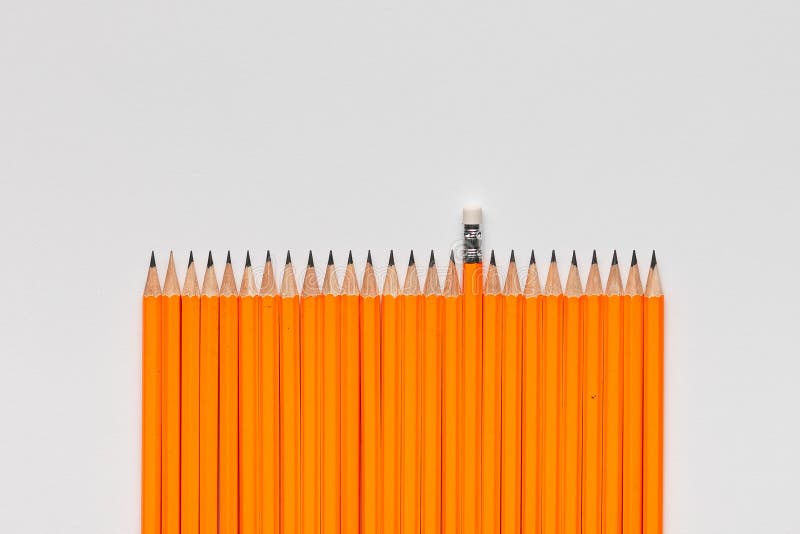 A bunch of pencils on white background, shot from above, aligned at the bottom, closeup. A bunch of wooden pencils on white background, shot from above, aligned royalty free stock photo