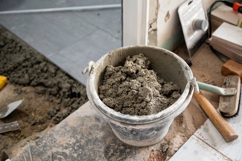 Cement in can with tools preparation install tile. Cement in can with tools preparation for install tile stock image