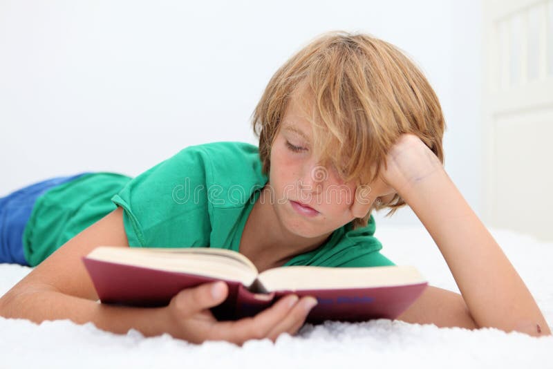 Child reading bible stock photography