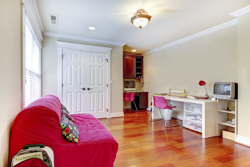 Children home study play room interior with pink sofa. royalty free stock images