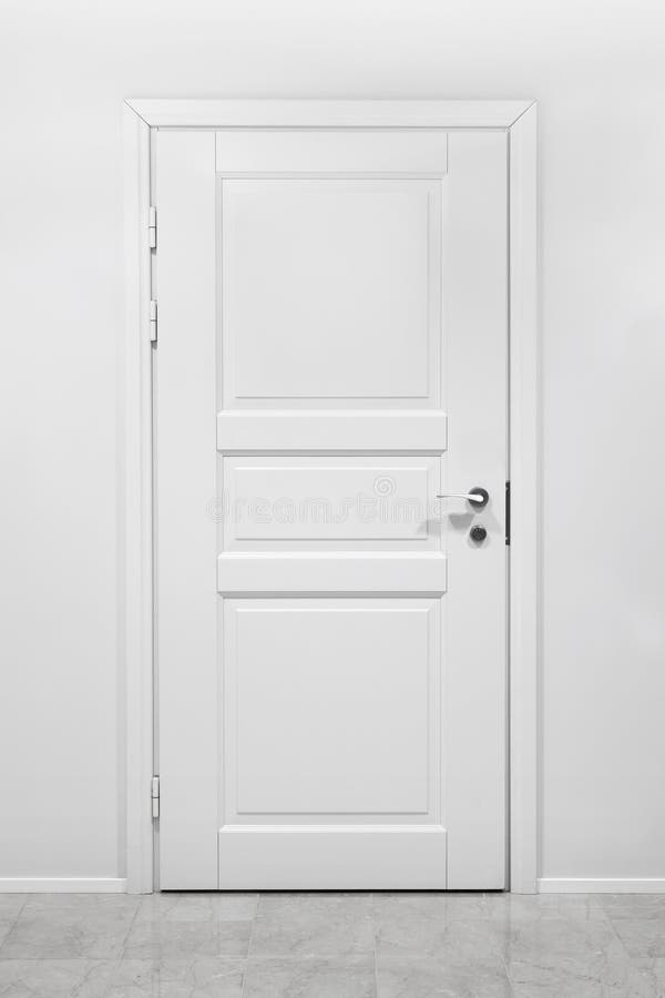 Classical closed wooden door in white office royalty free stock photo