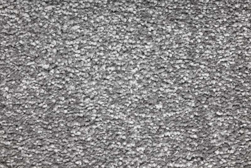 Clean gray carpet texture. Close up of a clean gray carpet texture or background. Macro shot stock photo