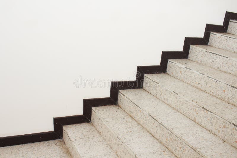 Close up Stairs terrazzo,marble floor in sideways of a wall.  royalty free stock photo