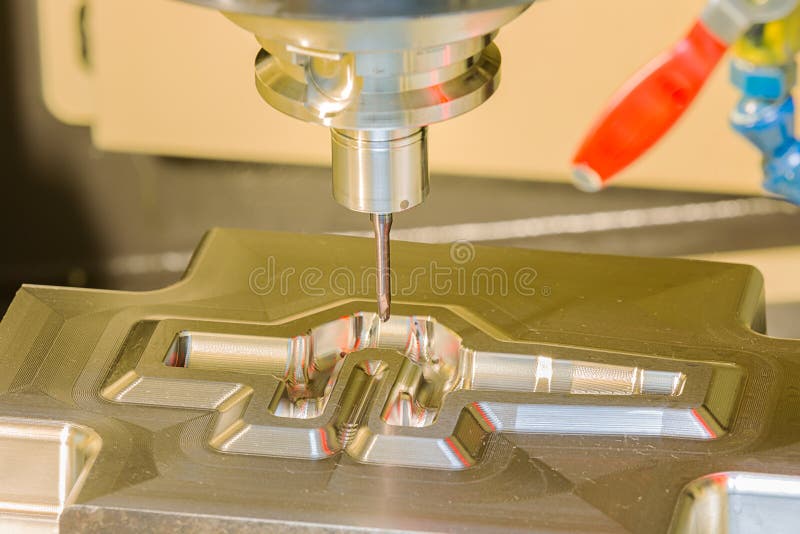 CNC machining center cutting forging die by endmill cad cam. CNC machining center cutting forging die by carbide endmill cad cam royalty free stock images