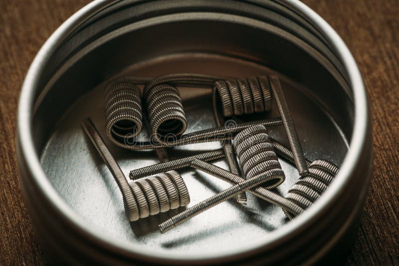 Coils for vape or e-cig dripping atomizers or RDA, accessories for vaping, macro shot. Toned stock images