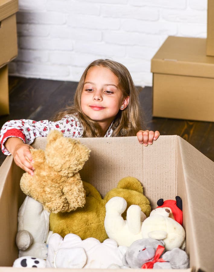 Come home with confidence. purchase of new habitation. Cardboard boxes - moving to new house. repair of room. new. Apartment. happy little girl with toy. happy stock photos