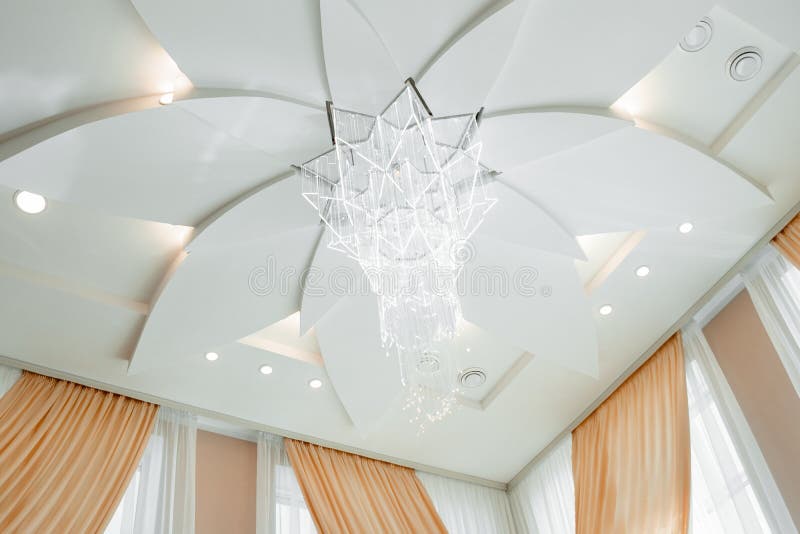 Composition of an interesting apartment interior. ceiling with a chandelier.  royalty free stock photography