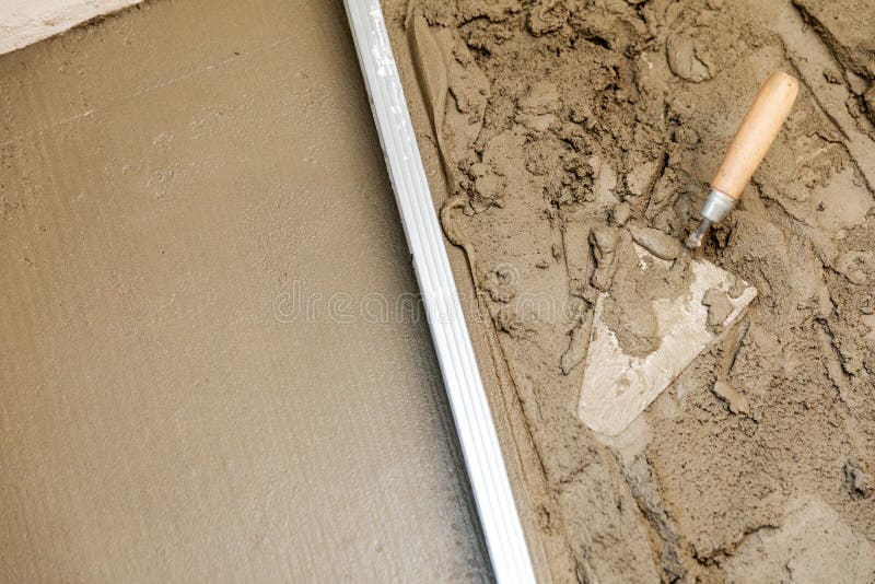 Concrete screed floor align. trowel and rail on wet mortar. Top view royalty free stock images