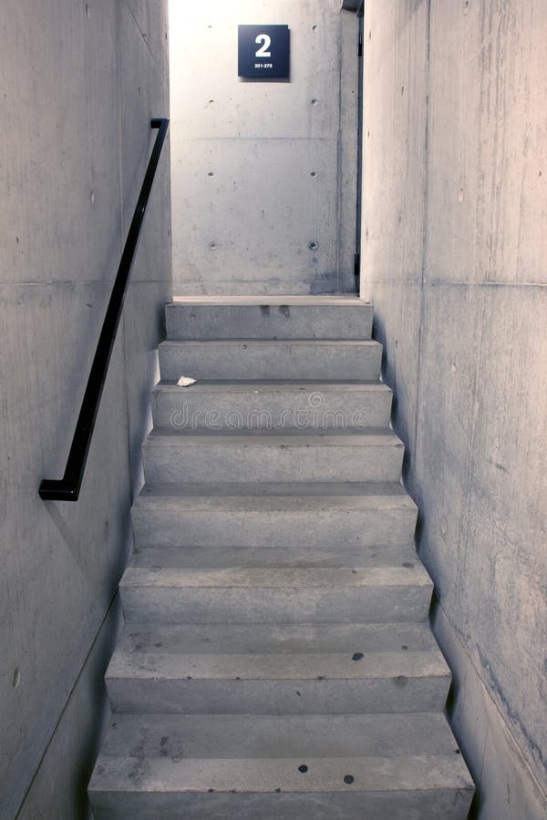Concrete staircase and stairs leading upwards to second floor stock images