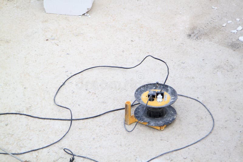 Construction electric tool are on a concrete screed. Construction electric tools are on a concrete screed stock photography