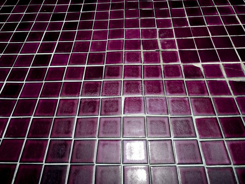 Dark purple floor tiles with copy space for your work. Full frame of dark purple floor tiles in bathroom with blank space royalty free stock images