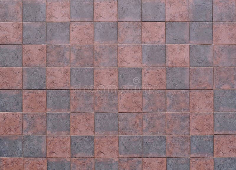 Dark red and gray stone tiles floor. Travertine, background and texture. Top view stock photo