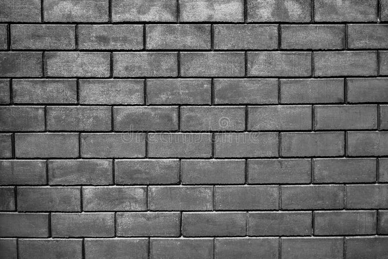 Dark room with tile floor and brick wall background stock photo