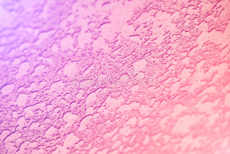 Decorative plaster on the wall. Color orange texture background. Decorative plaster on the wall. Color pink and purple texture background. Concept decoration royalty free stock photography