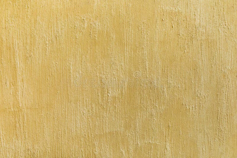 Decorative shabby plaster wall in beige color. Concrete scratched texture. Empty background royalty free stock photography