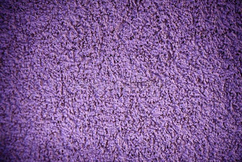 Decorative Ultra purple plaster texture on the wall - art brush stroke background.  royalty free stock photography