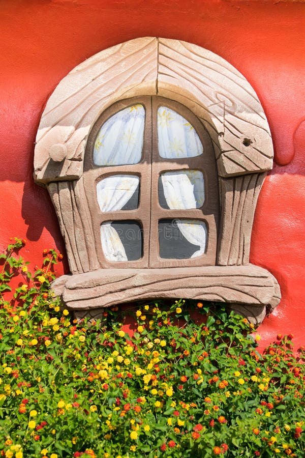 Detail of the plastic window of a small house for children in a. Verona, Italy - September 8, 2015: Detail of the plastic window of a small house for children in stock photos