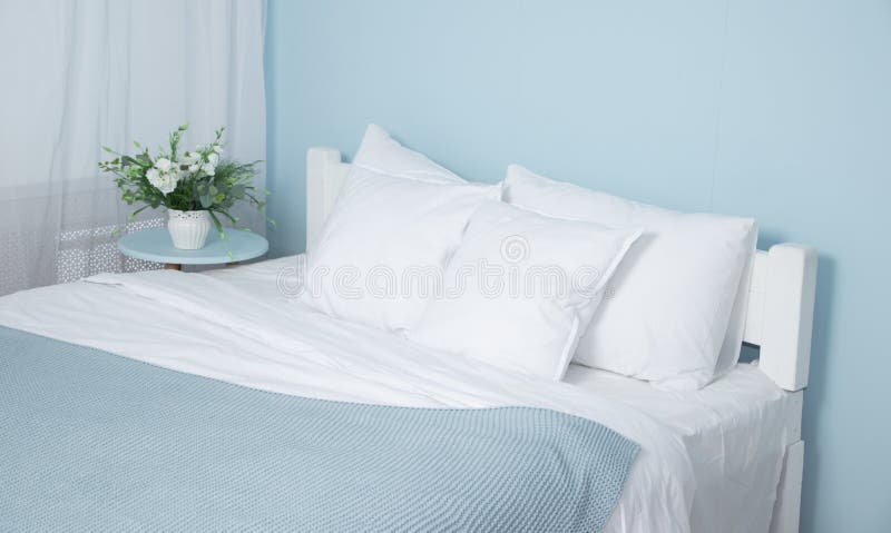Double bed with lifting mechanism and mattress. The white mattress. Large bright bed stock images